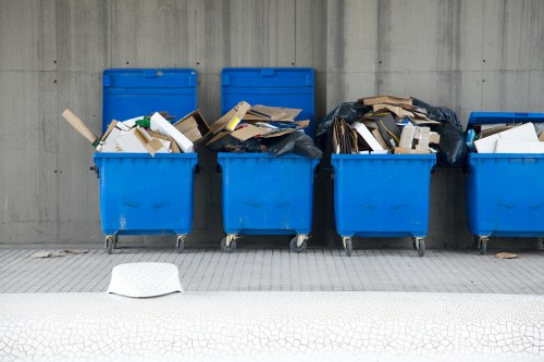Cluttered garage being organized by professionals